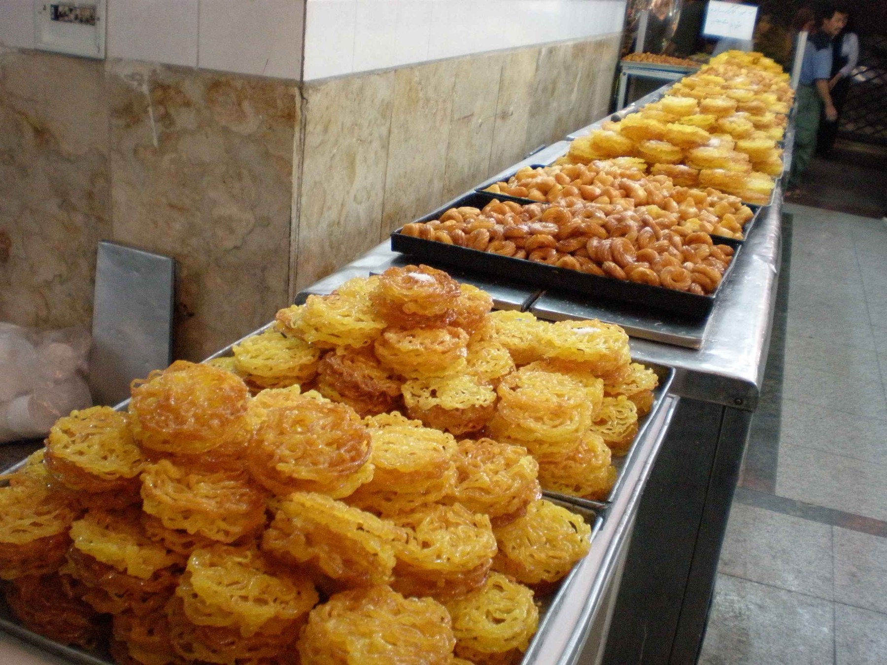 Zoolbia and bamieh — Persian syrup-soaked fried sweets.