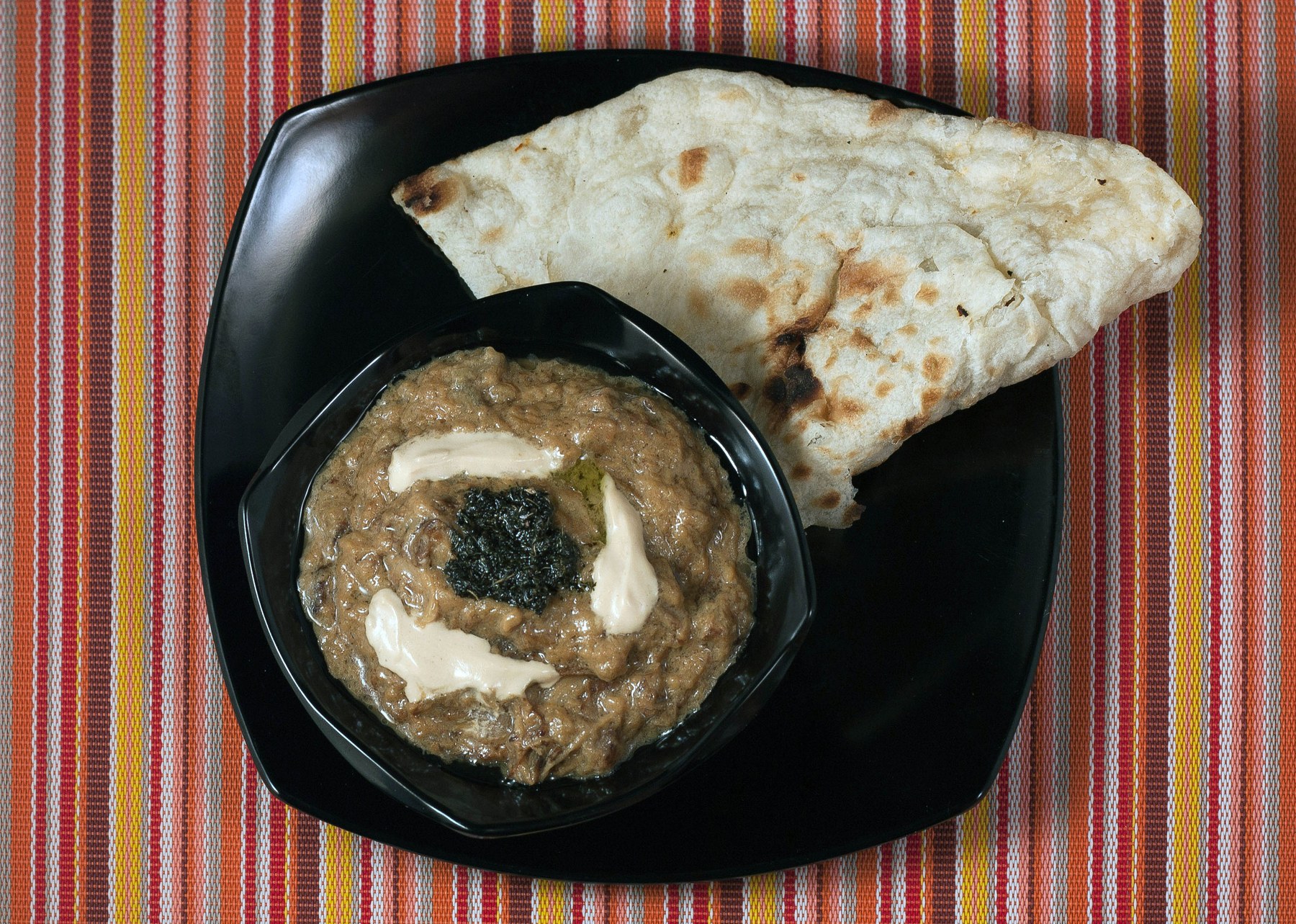 Kashk-e bademjan — Persian aubergine dip with kashk and fried mint.